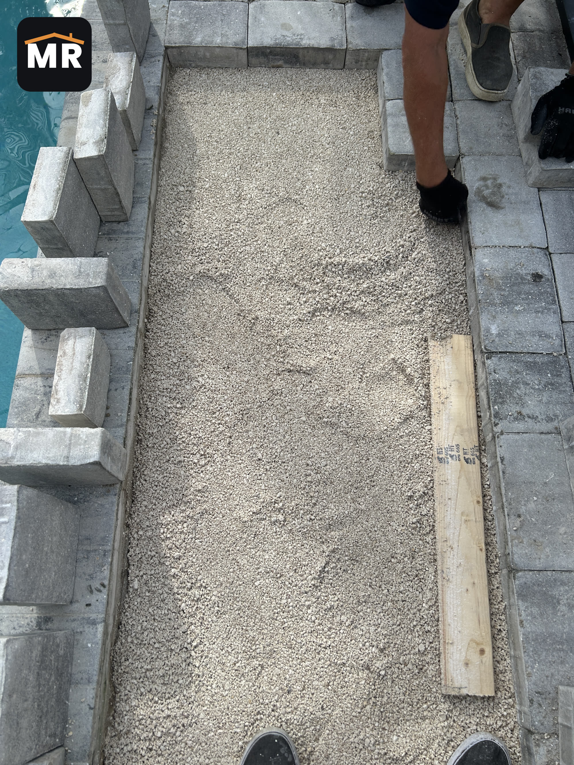 Fresh crushed-stone base leveled under the pool deck pavers in Nokomis, FL