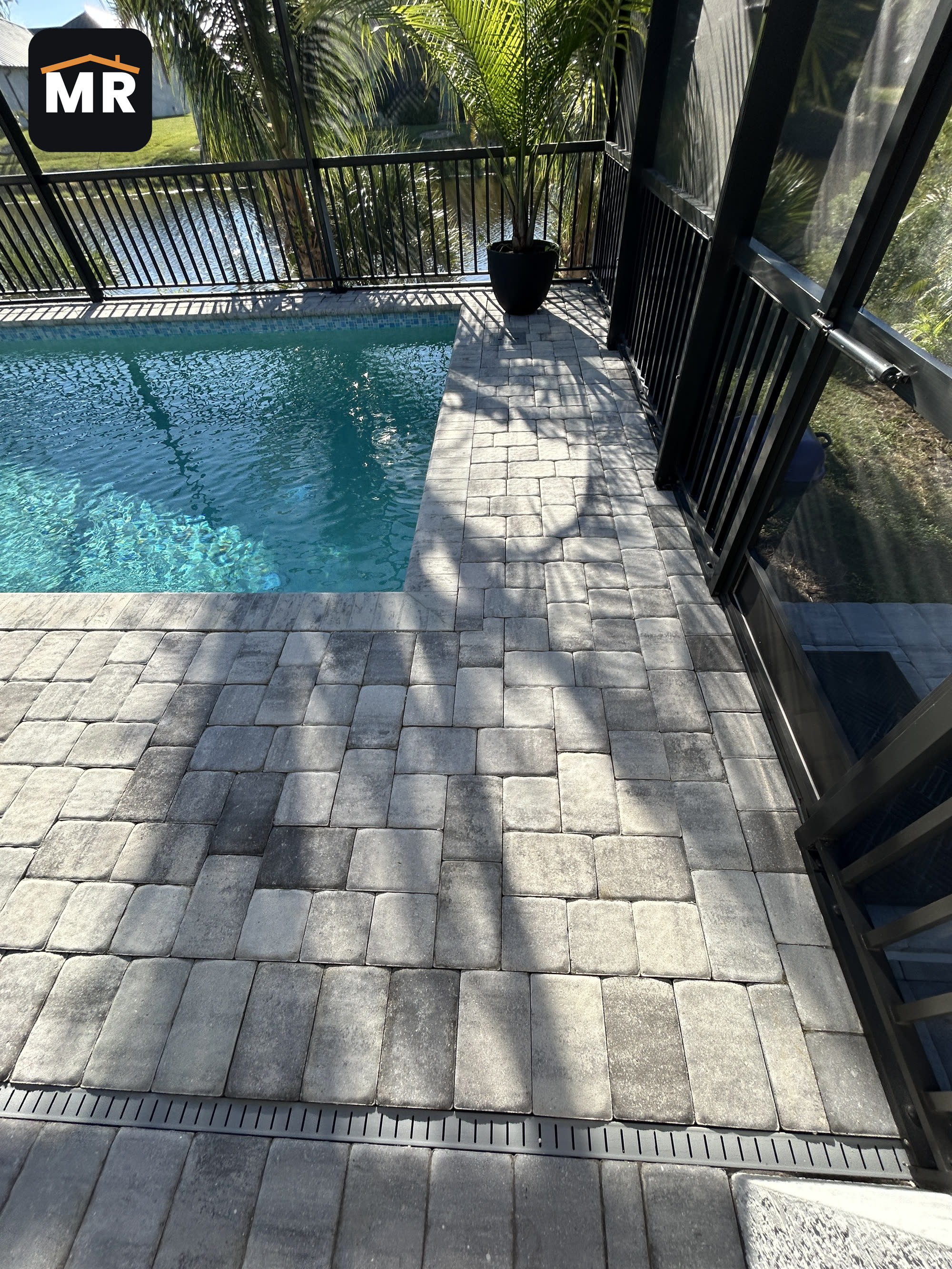 Pavers reset level on the finished pool deck at a Nokomis, FL home