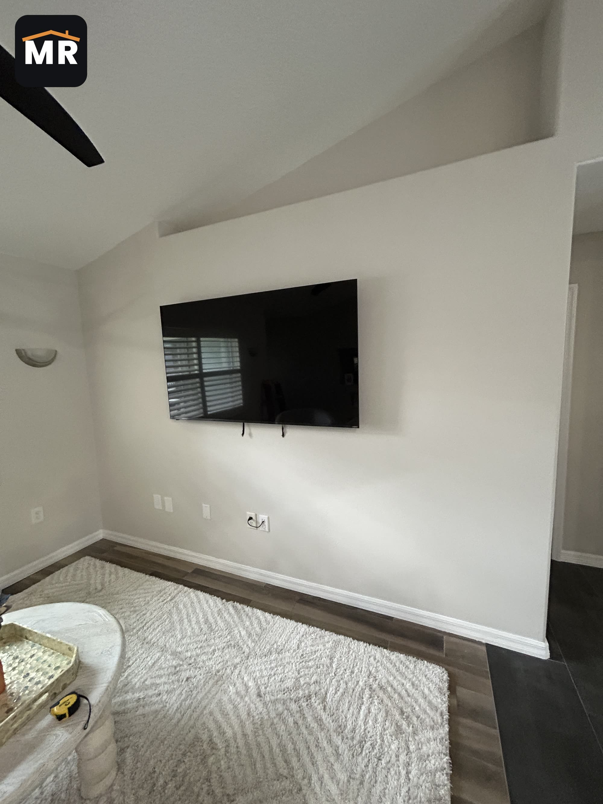 Venice TV mount: 65 inch TV installed with wires hidden and a brush plate for a clean finish